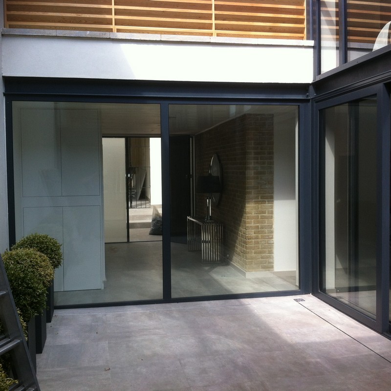 Floor-to-ceiling sliding doors opening to courtyard in Streatham Hill