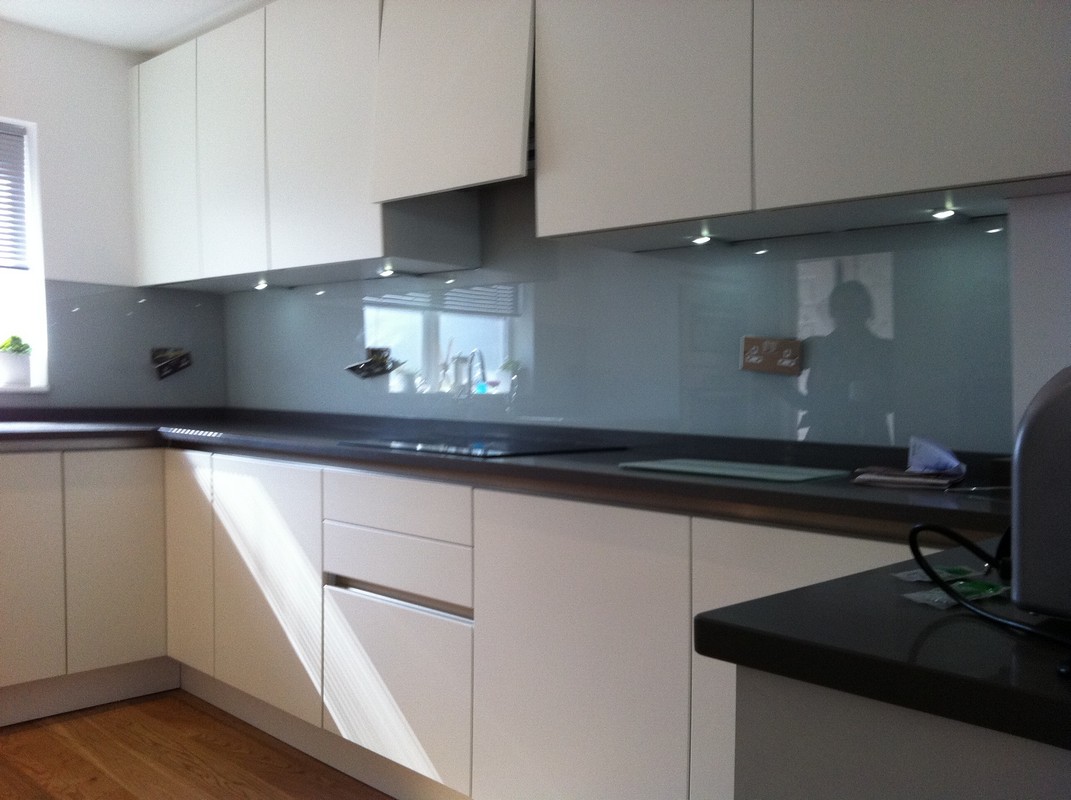 Grey glass kitchen splashback with LED lighting in Streatham Hill