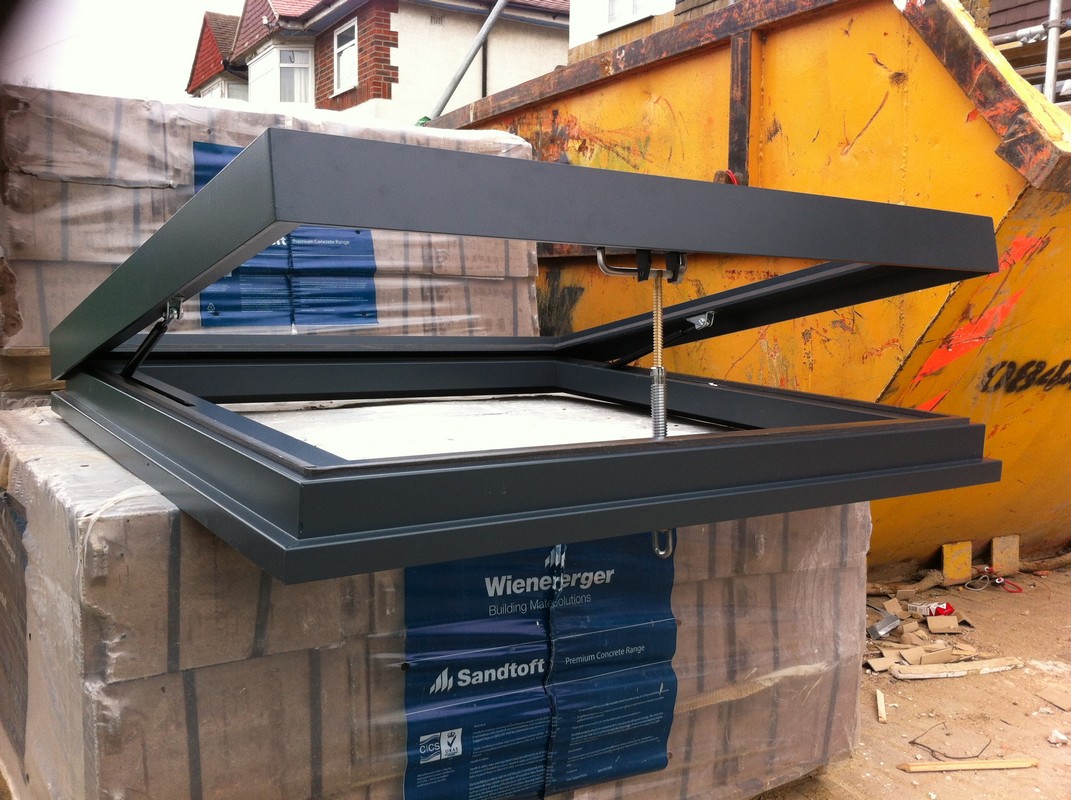 Opening flat roof skylight in anthracite grey installed in Streatham Hill